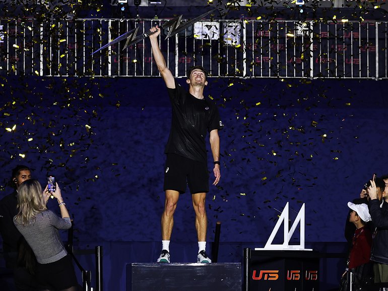 Alex de Minaur of Australia celebrates with the trophy after winning the final against Casper Ruud of Norway during the UTS London Grand Final 2025.