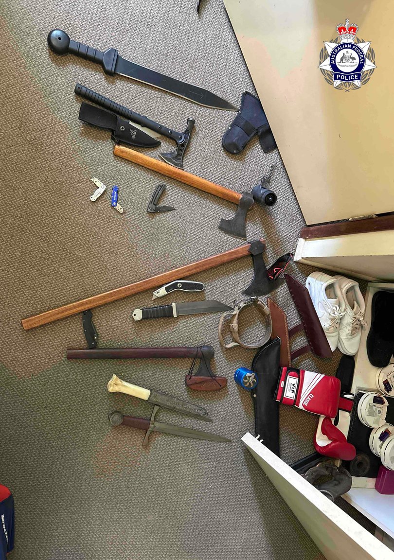 Nazi-related items, including books, a sword, axes and flags were seized.