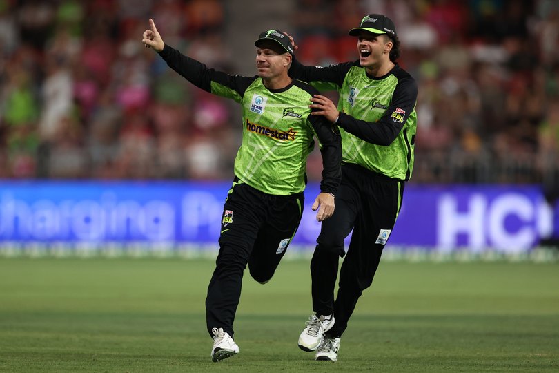 David Warner celebrates a wicket with Sam Konstas.