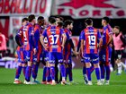 San Lorenzo players huddle during a game. The top tier club is one of 10 that have been raided as part of the investigation into the AFA.