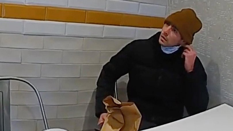 Luigi Mangione, a suspect in the fatal shooting of UnitedHealthcare CEO Brian Thompson, is confronted by police at a McDonald's.