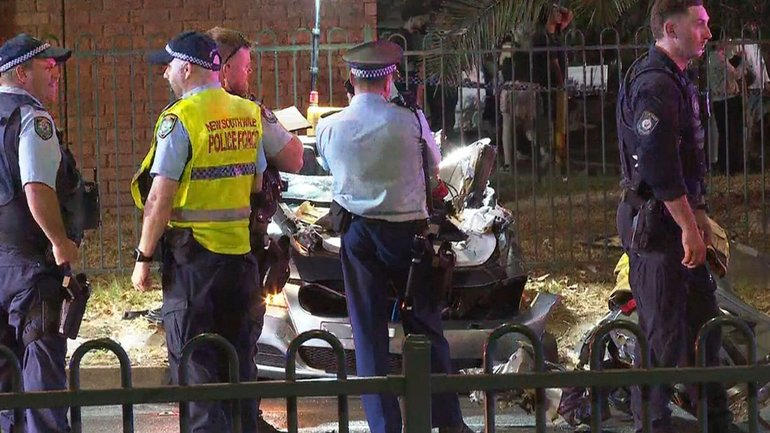 A three-way car crash involving a stolen vehicle has left a woman in critical condition.