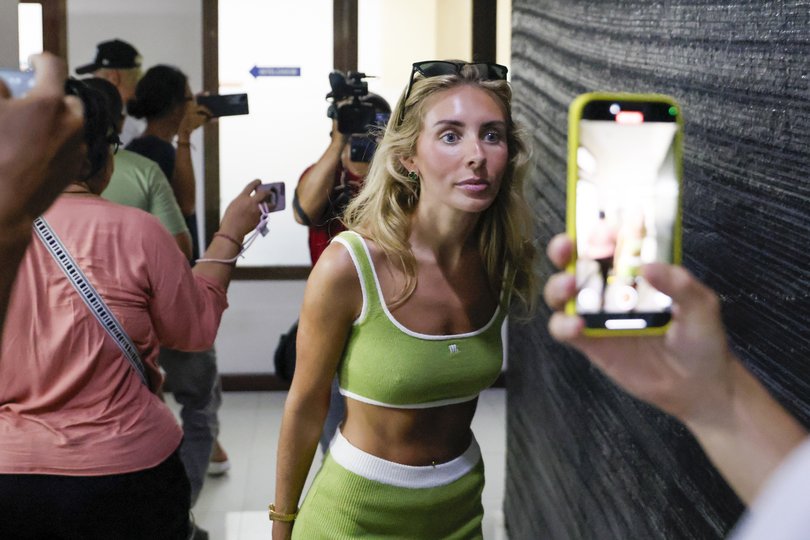 British adult content creator Tia Billinger, known as 'Bonnie Blue,' arrives at Bali’s immigration office for questioning in Badung, Bali.