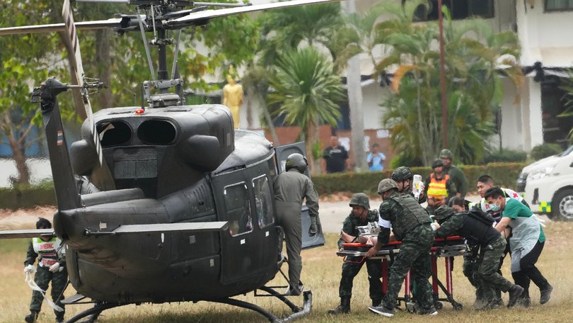 An wounded Thai soldier is carried to be transferred to a hospital, in Surin province, Thailand, following clashes between Thai and Cambodian soldiers.