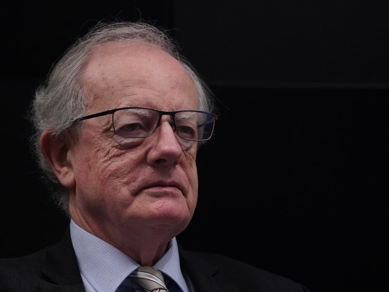 Anti-corruption commissioner Paul Brereton reluctantly agreed to step aside from investigations into the defence force after it was revealed he is helping an investigation into alleged war crimes.