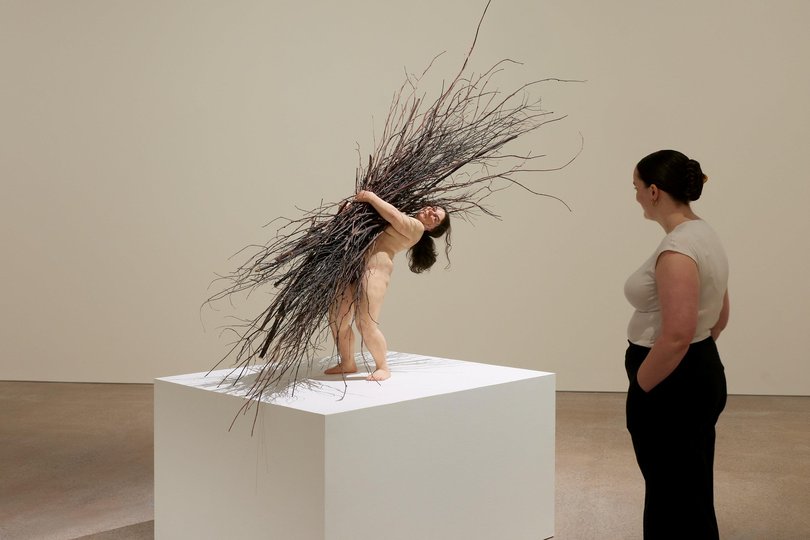 Installation view of the ‘Ron Mueck: Encounter’ exhibition, featuring 'Woman with Sticks'.