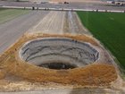 An aerial view of a sinkhole in a field at Konya valley in Konya, Turkiye.
