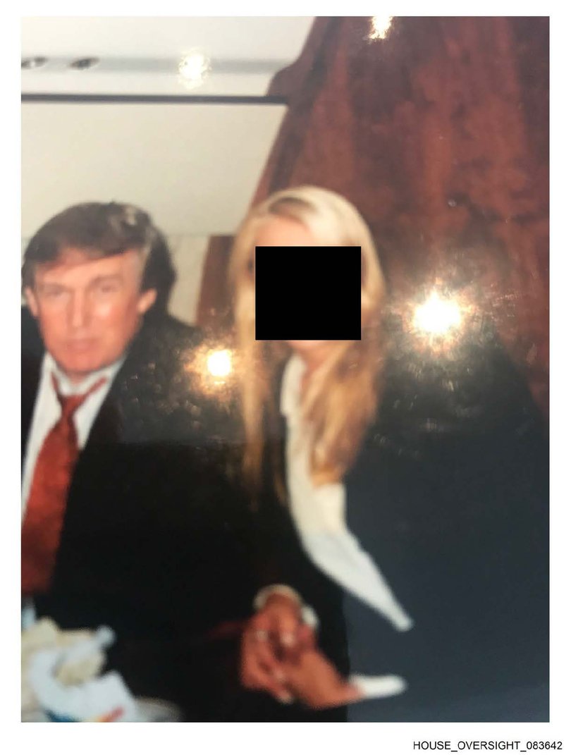 Donald Trump on a plane with a mystery woman.