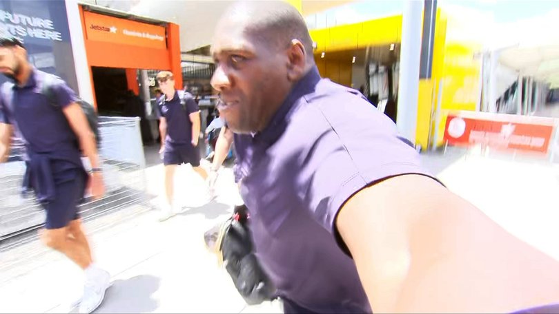 A security guard giving the camera operator an arm bar.