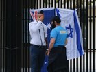 SYDNEY, AUSTRALIA - DECEMBER 15: Alex Ryvchin, Co-Chief Executive Officer of the Executive Council of Australian Jewry, left, mourns in front of the Bondi Pavilion at Bondi Beach on December 15, 2025 in Sydney, Australia. Police say at least 10 people, including one suspected gunman, were killed and more than a dozen others injured when two attackers opened fire near a Hanukkah celebration at the world-famous Bondi Beach, in what authorities have declared a terrorist incident. (Photo by George Chan/Getty Images)