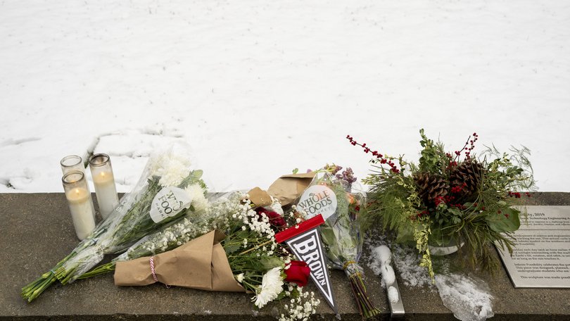 A makeshift memorial outside the Barus and Holley Building on the Brown University campus in Providence, a day after a gunman opened fire there.