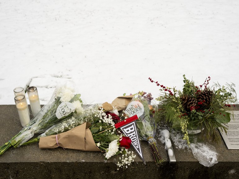 A makeshift memorial outside the Barus and Holley Building on the Brown University campus in Providence, a day after a gunman opened fire there. 