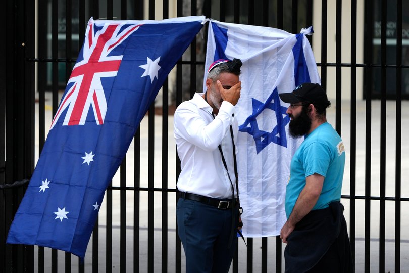 Alex Ryvchin, left, Co-Chief of the Executive Council of Australian Jewry, reacts outside Bondi Pavilion at Sydney's Bondi Beach.