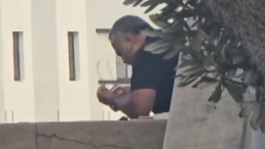 Bondi gunman Sajid Akram is pictured putting his glasses on before continuing his sickening attack.