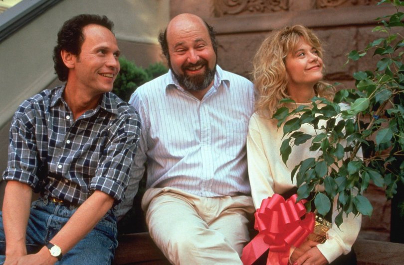 Rob Reiner on the When Harry Met Sally set with Billy Crystal and Meg Ryan.