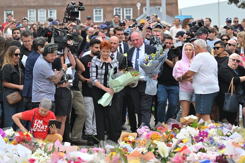 One Nation Leader Pauline Hanson and One Nation member for New England Barnaby Joyce place flowers at a makeshift memorial at Bondi Beach in Sydney, Tuesday, December 16, 2025. Australia is in mourning after gunmen opened fire on Bondi Beach, killing 16 people in an attack designed to target the Jewish community. (AAP Image/Mick Tsikas) NO ARCHIVING