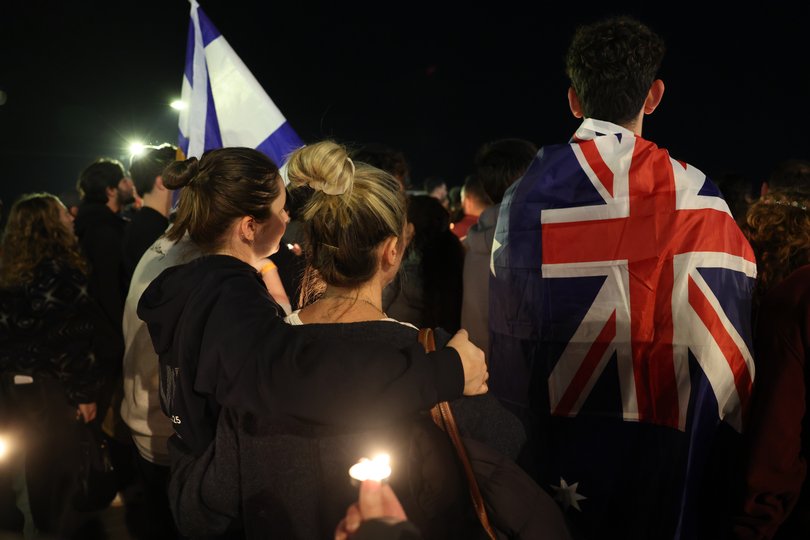 People light candles in solidarity with the victims of the attack in Bondi at the beach of Tel Aviv, Israel.