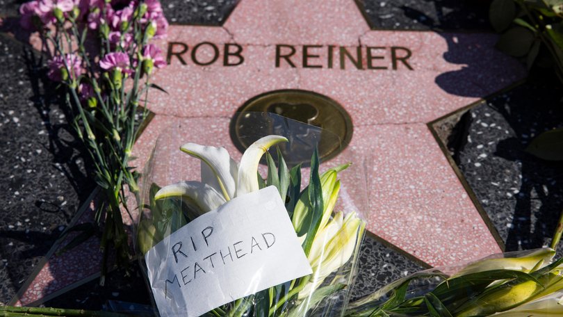Flowers are seen placed on top of Rob Reiner's Hollywood Walk of Fame Star.