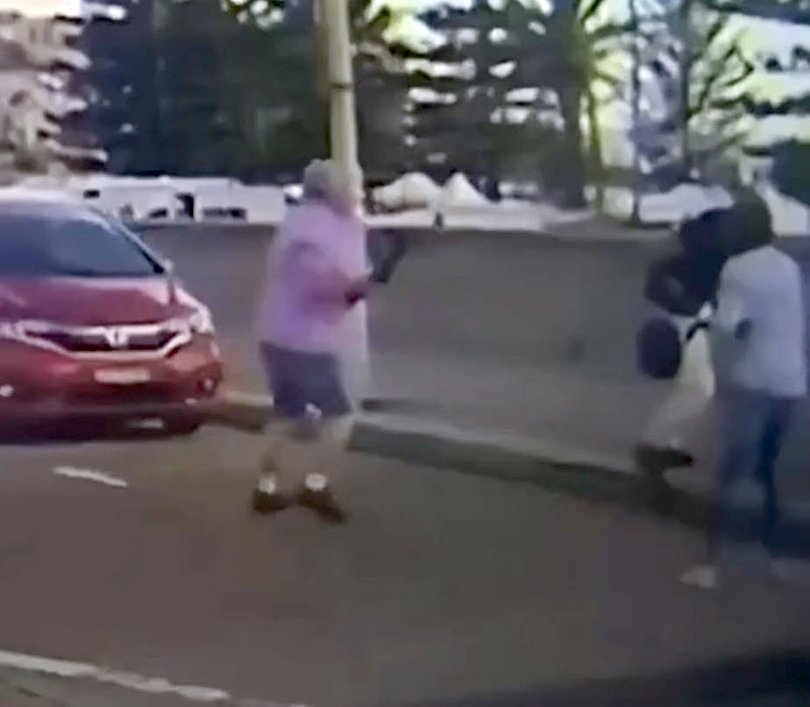 Brave moment Bondi beachgoers walking past gunmen’s car try to disarm the terrorist before he started shooting.