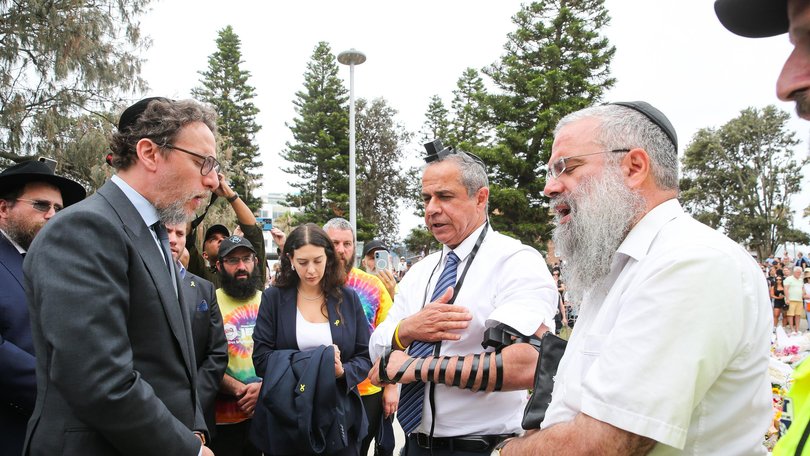 SYDNEY, AUSTRALIA -NewsWire Photos DECEMBER 16th 2025: IsraelÃs Ambassador to Australia Amir Maimon prepares to pray at a makeshift memorial at Bondi Beach in Sydney, after two gunmen opened fire on Bondi Beach killing 16 people in an attack designed to target the Jewish community. Photo: Gaye Gerard /NewsWire Gaye Gerard NewsWire