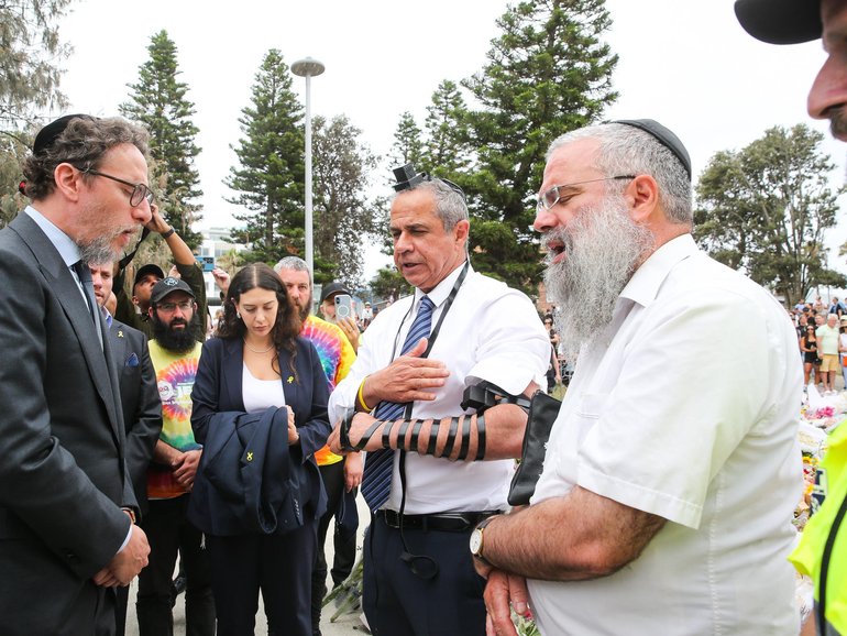 SYDNEY, AUSTRALIA -NewsWire Photos DECEMBER 16th 2025: IsraelÃs Ambassador to Australia Amir Maimon prepares to pray at a makeshift memorial at Bondi Beach in Sydney, after two gunmen opened fire on Bondi Beach killing 16 people in an attack designed to target the Jewish community. Photo: Gaye Gerard /NewsWire Gaye Gerard NewsWire