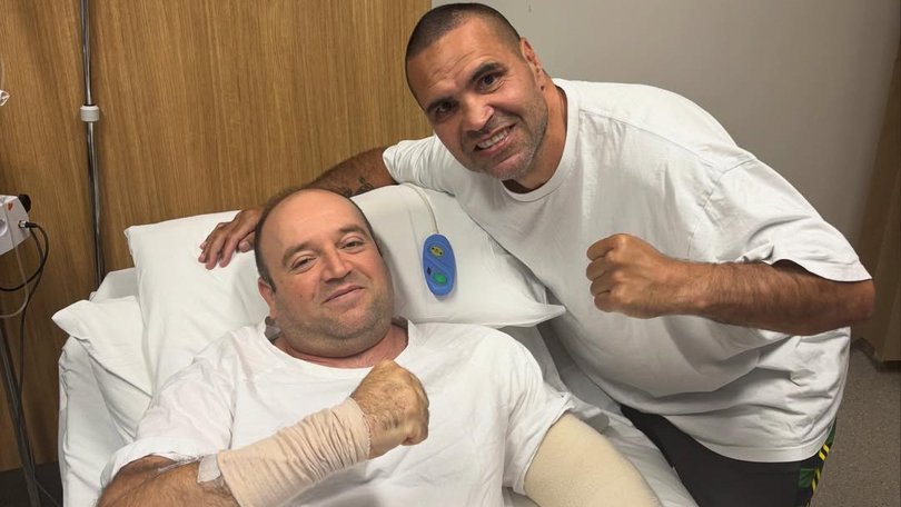 Anthony Mundine poses alongside Bondi hero Ahmed al-Ahmed.