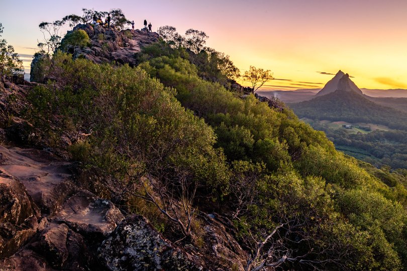 Sunset at the top of mt Ngungun. View toward mt Coonowin and Mt Beerwah from Glass House Mountains.