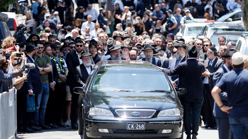 Mourners attend the funeral service for Rabbi Eli Schlanger at Chabad of Bondi.