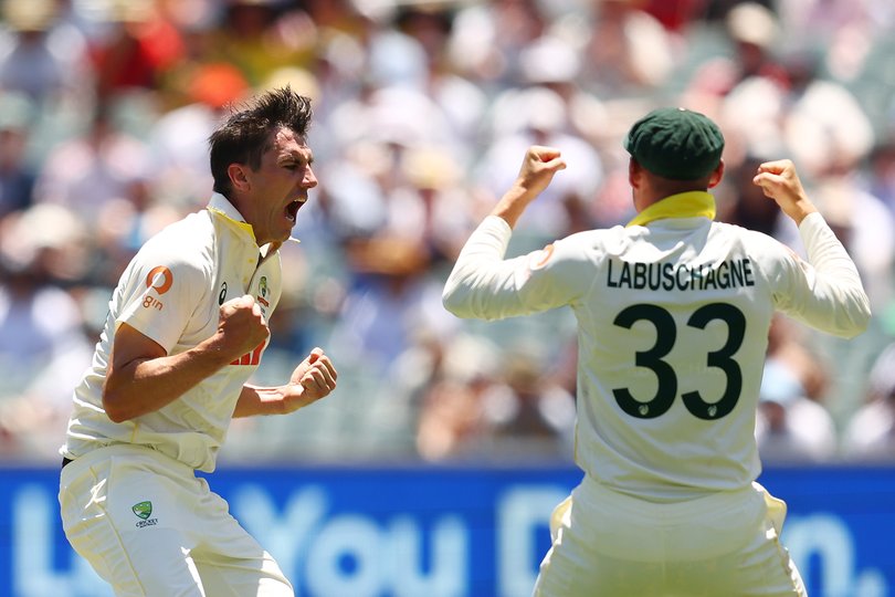 ADELAIDE, AUSTRALIA - DECEMBER 18: Pat Cummins of Australia celebrates taking the wicket of Joe Root of England for 19 runs during day two of the Third Test Match in the 2025-26 Ashes Series between Australia and England at Adelaide Oval on December 18, 2025 in Adelaide, Australia. (Photo by Robert Cianflone/Getty Images)