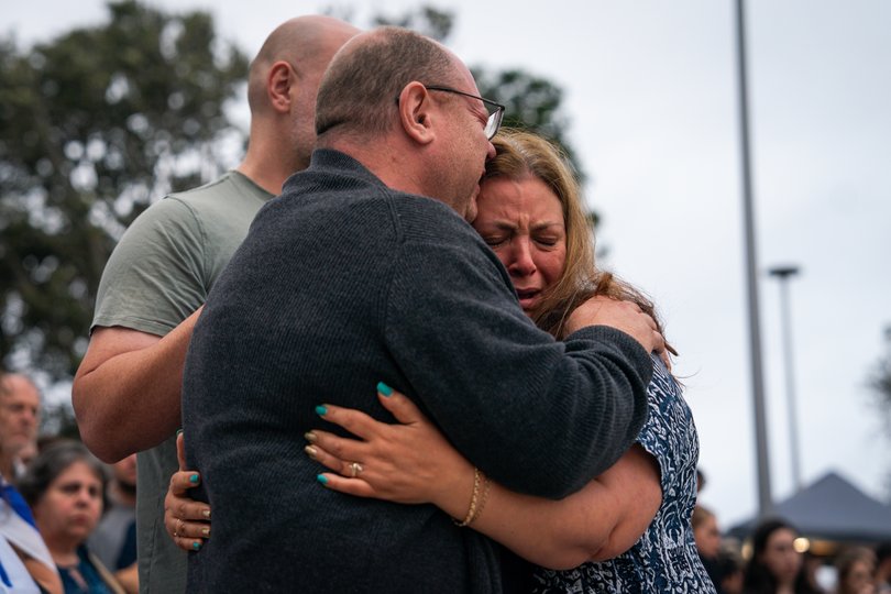 The parents of 10-year-old shooting victim, Matilda, attend a memorial at Bondi Pavilion.