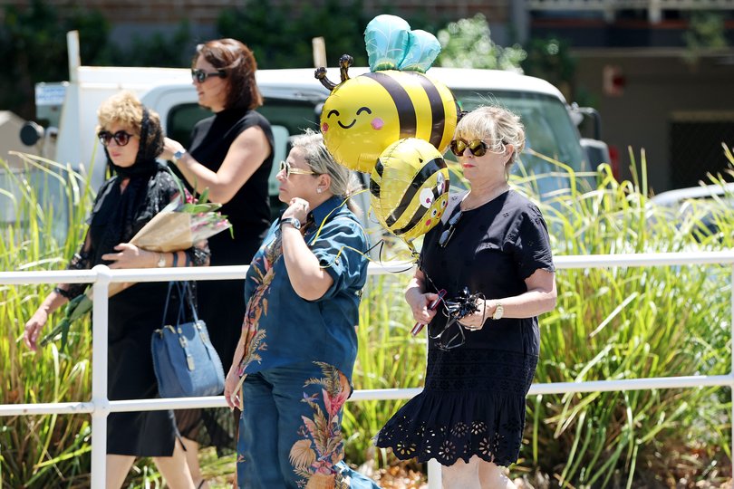 Mourners arrive at the funeral of 10 year old Matilda.