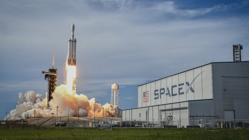 A SpaceX Falcon Heavy rocket lifts off.