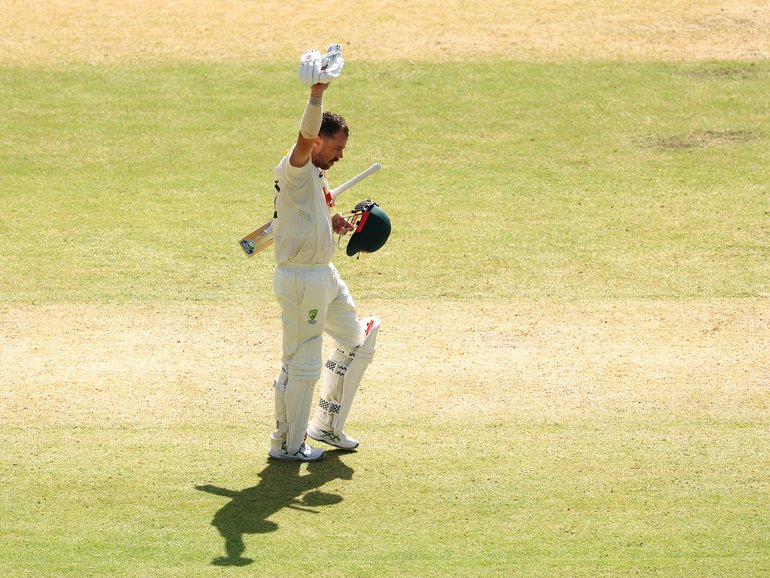 Travis Head celebrates scoring a century.