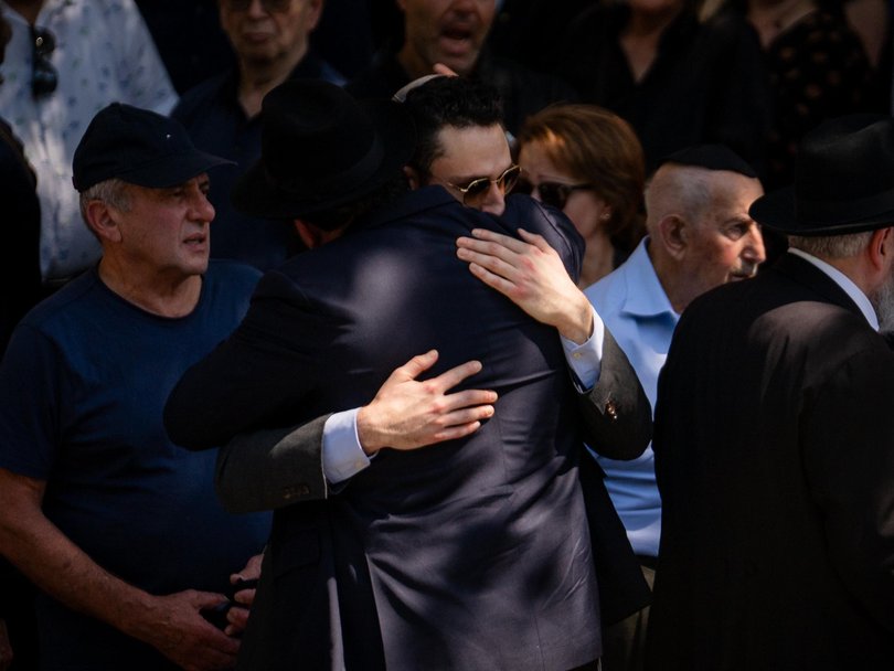 Mourners at the funeral for the Gurmans.