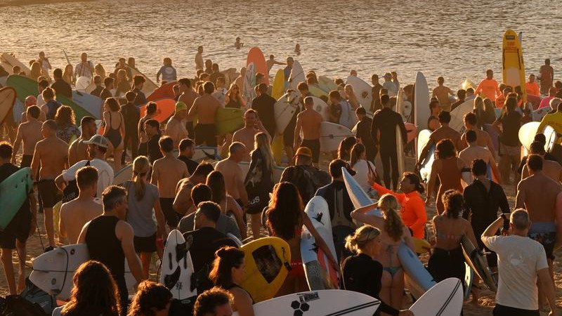 Boardriders have paddled out en masse at Bondi Beach in a show of support as victims are farewelled. 
