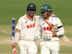 (L-R) Travis Head and Alex Carey of Australia embrace at the end of play on day three of the Third Test Match.
