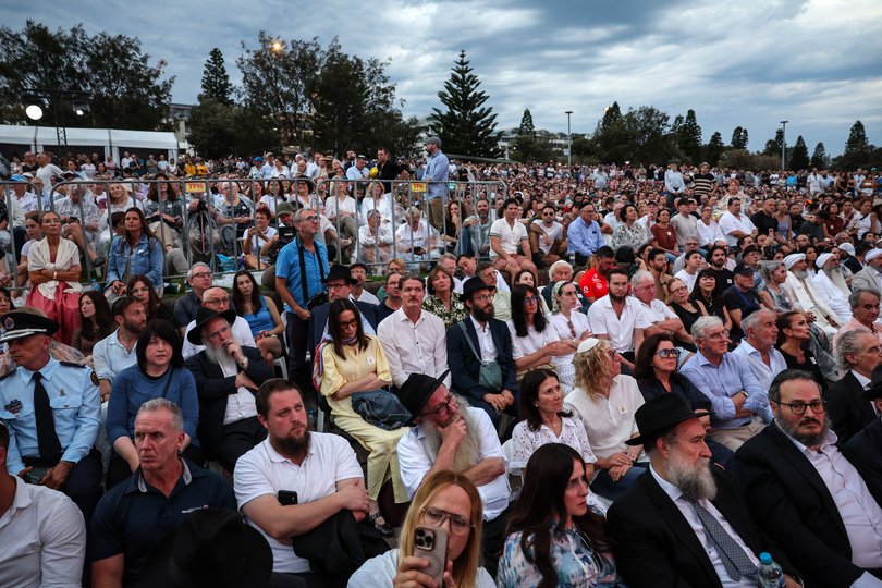 People attend a memorial for the victims of the mass shooting that took place last week at Bondi Beach on December 21, 2025 in Sydney, Australia. 
