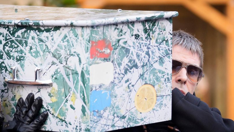 Liam Gallagher helped carry the coffin of Stone Roses and Primal Scream bass player Gary Mounfield. (AP PHOTO)