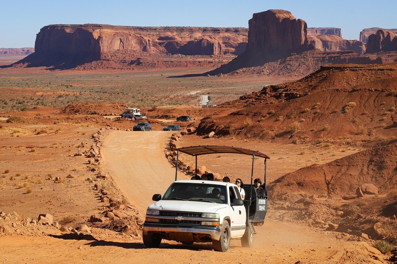 A tour vehicle drives along a road that loops through Monument Valley.  Pictures: Gabe Castro-Root/The New York Times