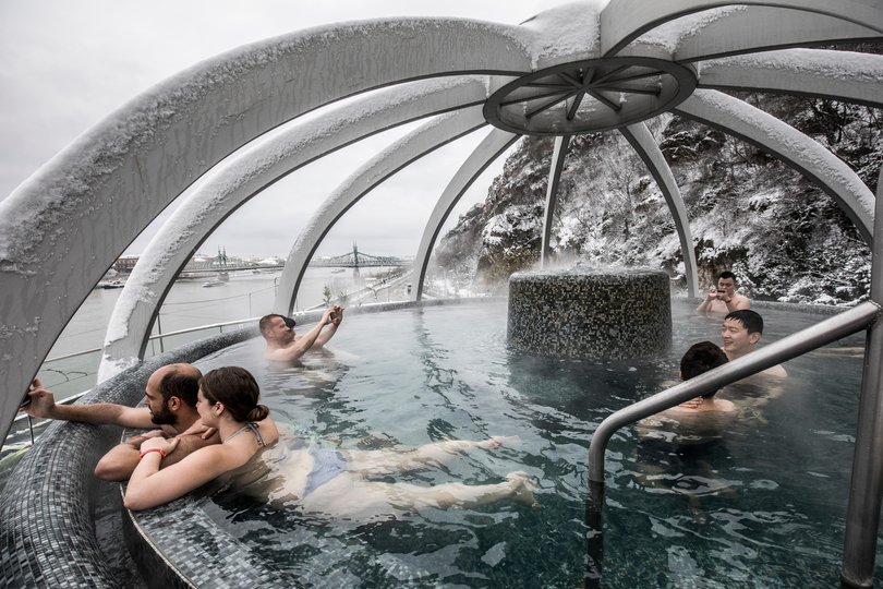 Bathers in the rooftop pool at Rudas Baths in Budapest, Hungary.