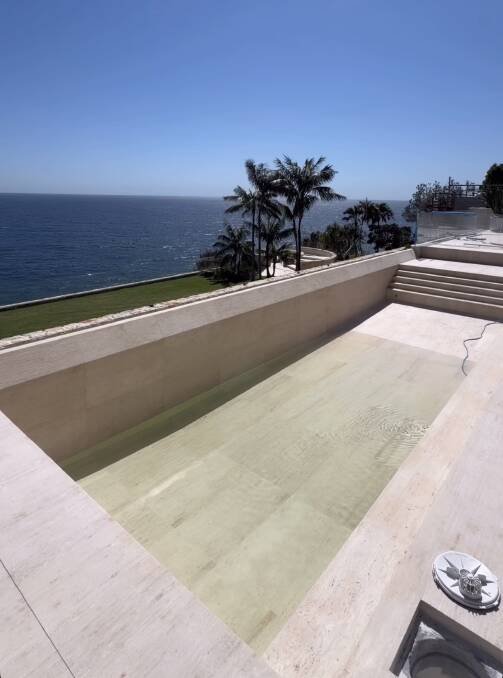 The infinity-edge swimming pool is cast in travertine stone. Picture Instagram
