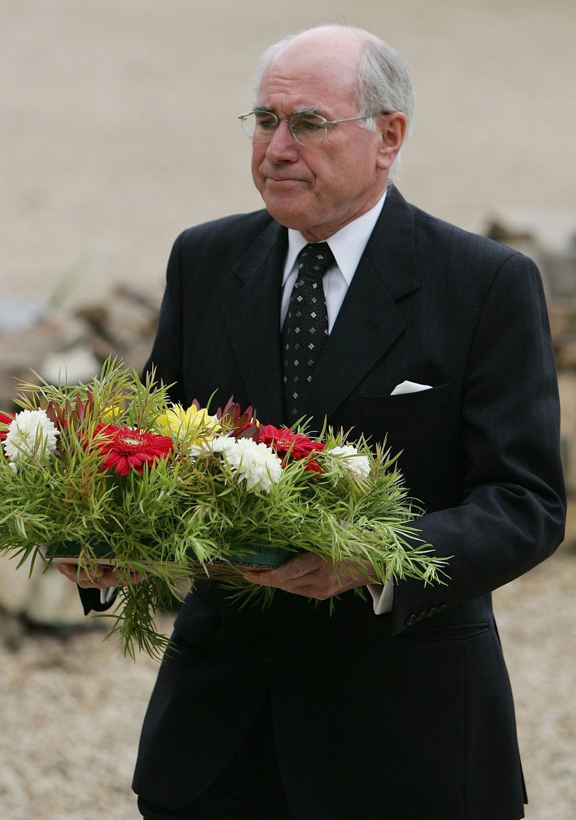  John Howard lays a wreath at the memorial site of the Port Arthur in 2006. 