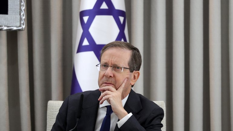 epa12575440 Israeli President Isaac Herzog looks on during a meeting with the German Chancellor Friedrich Merz (not pictured) at the President's residence in Jerusalem, 06 December 2025. EPA/ABIR SULTAN / POOL