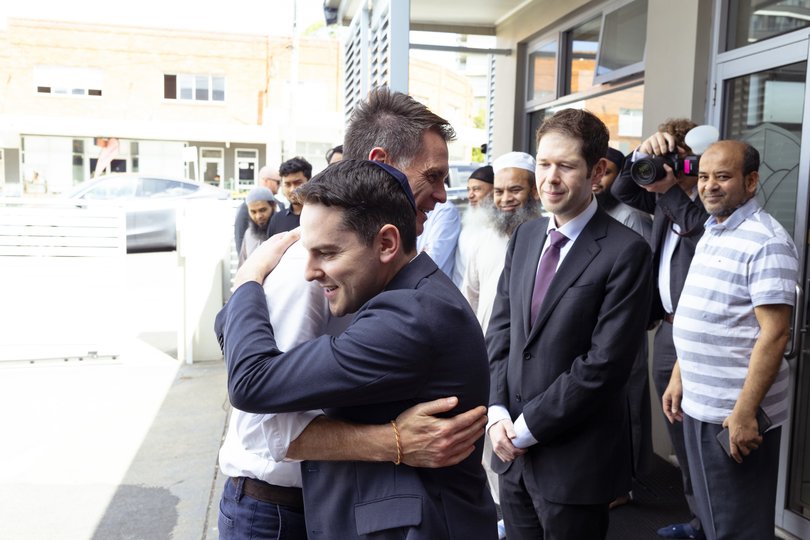 NSW Premier Chris Minns greets President of the NSW Jewish Board of Deputies, David Ossip as he arrives for an interfaith meeting at Masjid Al-Hidayah .