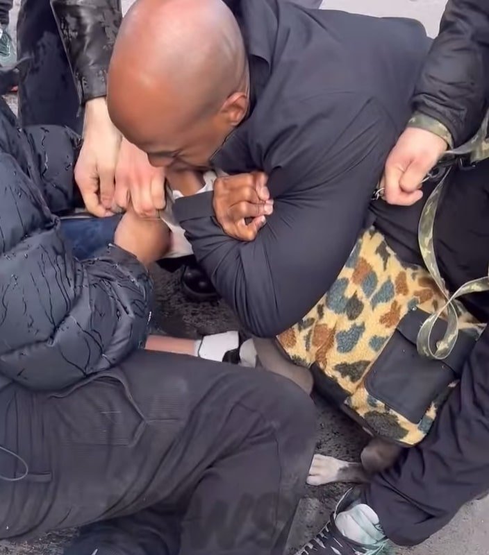 Several good Samaritans tried desperately to get the dog to release it’s grip on the child.