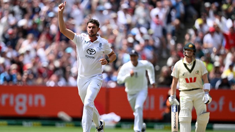 Josh Tongue of England celebrates with teammates after dismissing Marnus Labuschagne.