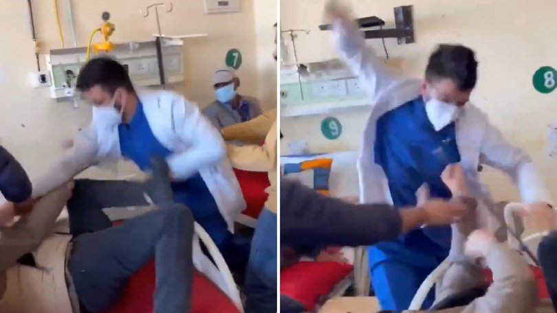 The moment a doctor repeatedly punches his patient has been caught on camera, sparking questions on what prompted the brutal attack in the first place. 