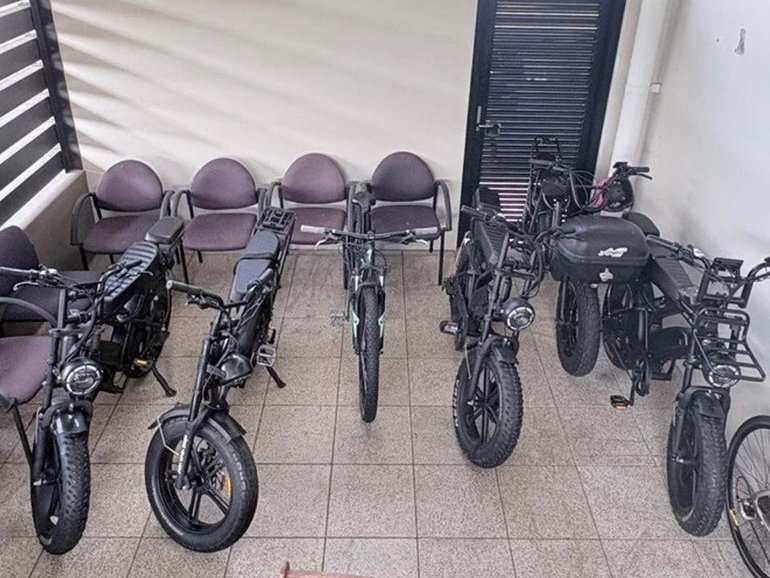 Police searched a home on Christmas Eve, discovering a stash of stolen e-bikes and e-scooters. (HANDOUT/QUEENSLAND POLICE)