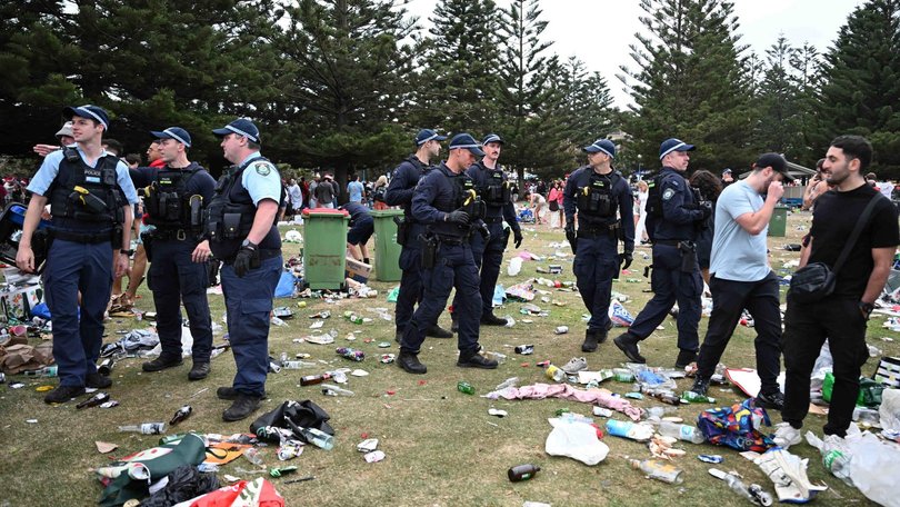 Police cleared the scene as revellers left large amounts of rubbish in their wake. NewsWire / Monique Harmer