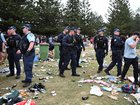 Police cleared the scene as revellers left large amounts of rubbish in their wake. NewsWire / Monique Harmer